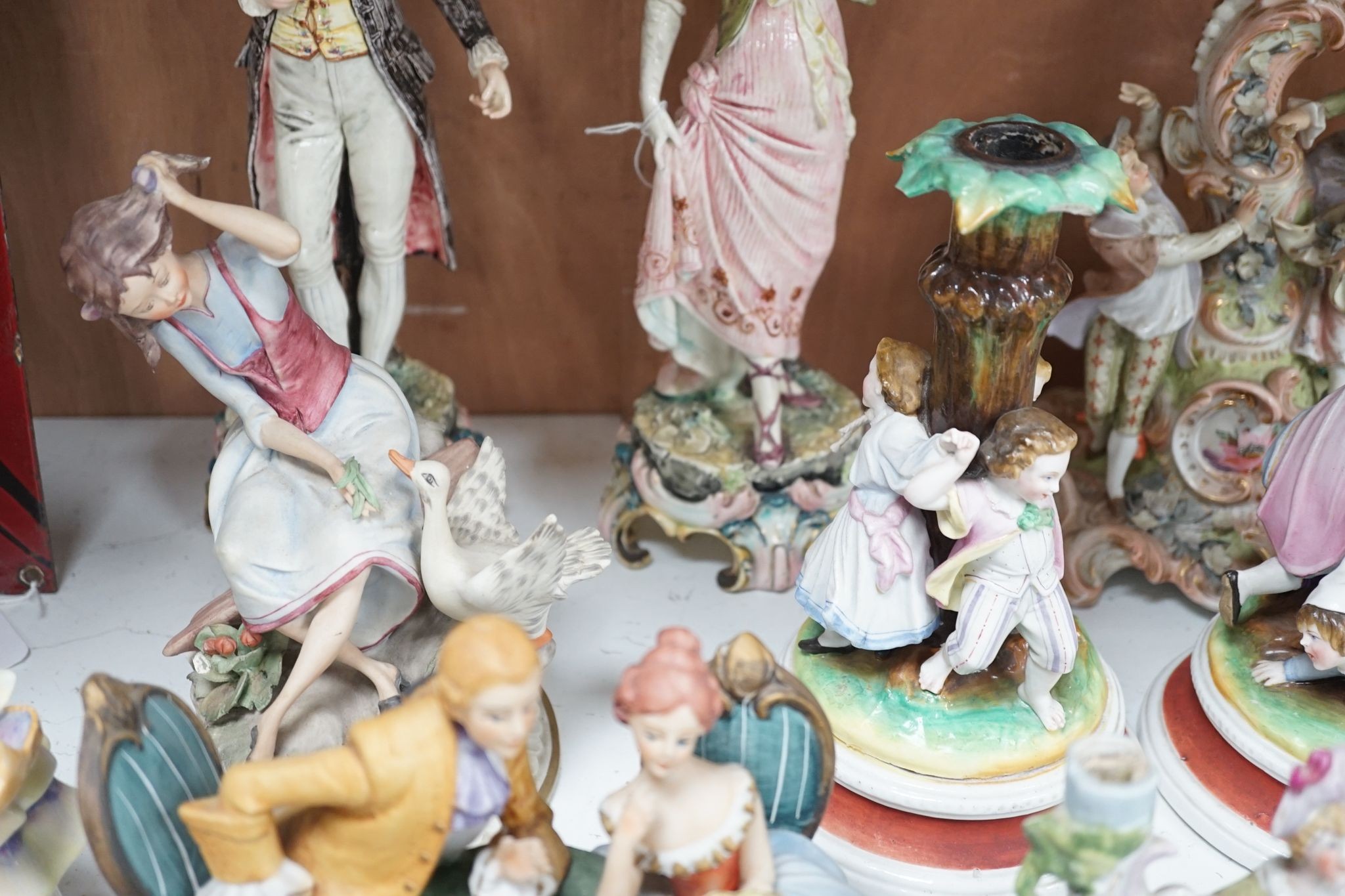 A quantity of various ceramic figures including two Doulton 'Valerie' and 'Meg', tallest figurative candlesticks 34 cms high.